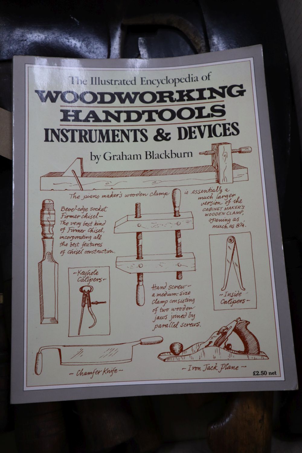 Mixed hand tools including a hatchet, together with the illustrated Encyclopedia of Woodworking Hand Tools and Devices by Graham Blackb